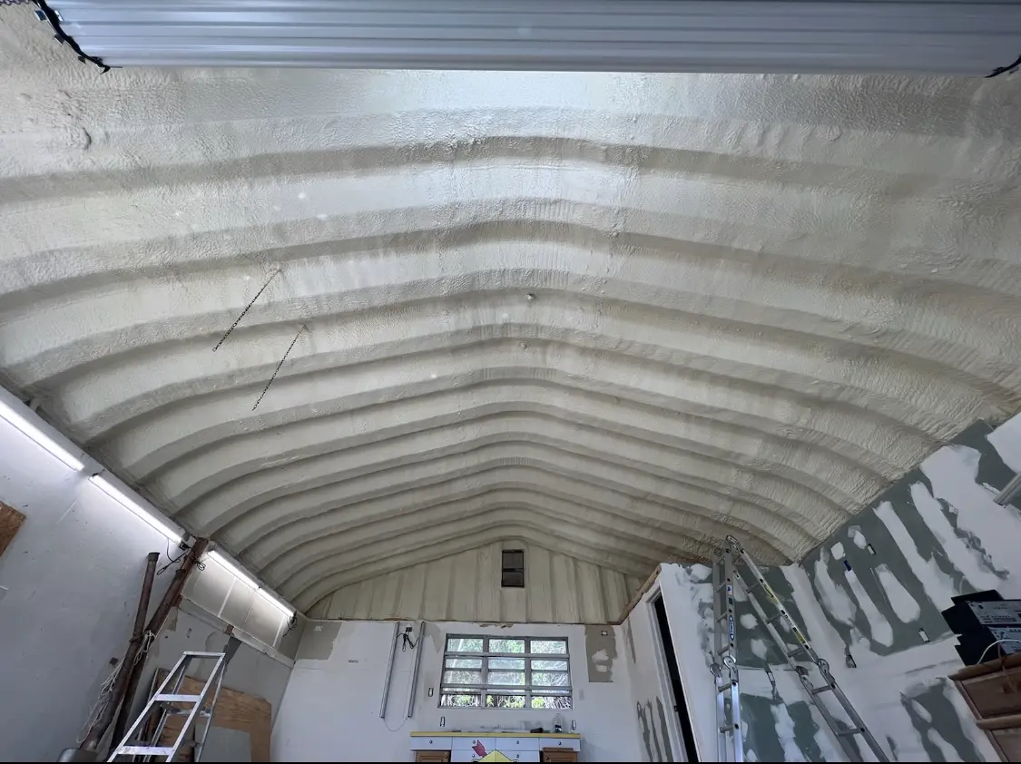 Spray polyurethane foam applied to the underside of a metal roof deck in Barstow
